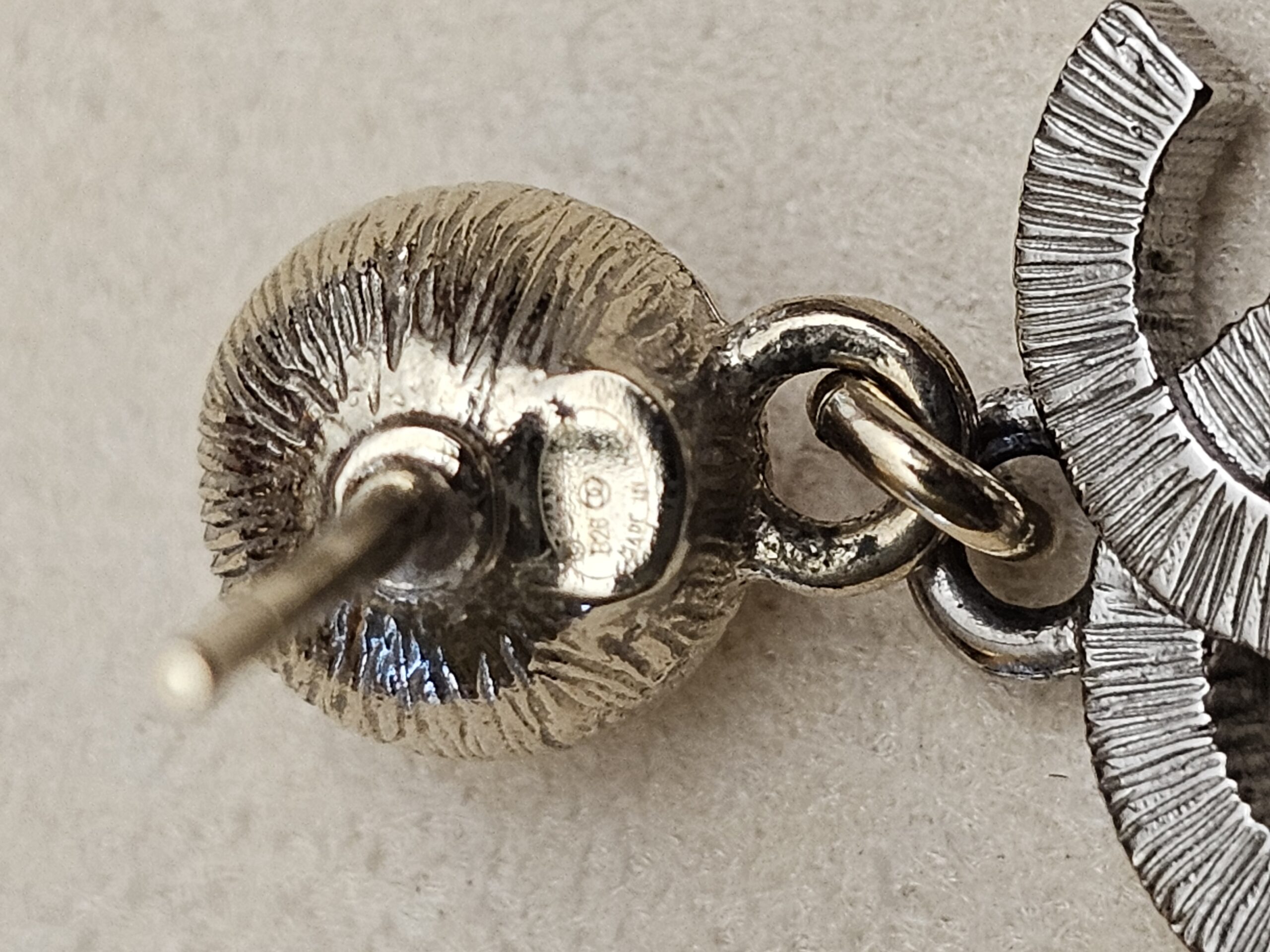 Back of the pearl setting with the post and stamp