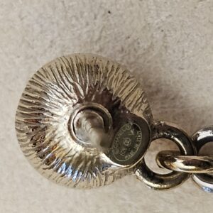 Stamped plate on the back of the stud