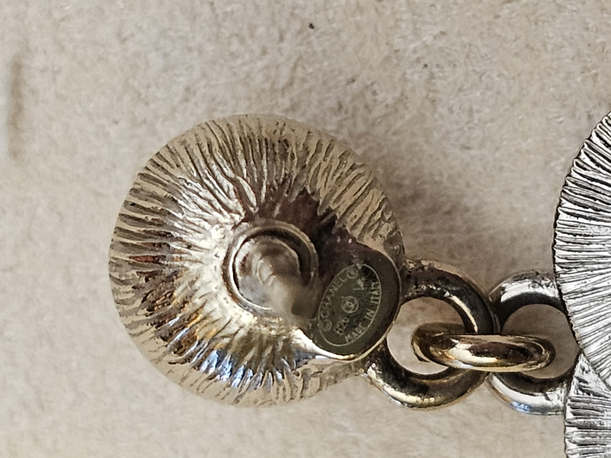 Stamped plate on the back of the stud