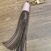 Louis Vuitton Monogram Tassel Bag Charm Pink - full length with the pink leather cap and gold-tone clasp
