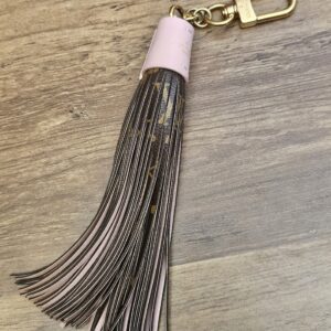 Louis Vuitton Monogram Tassel Bag Charm Pink - full length with the pink leather cap and gold-tone clasp