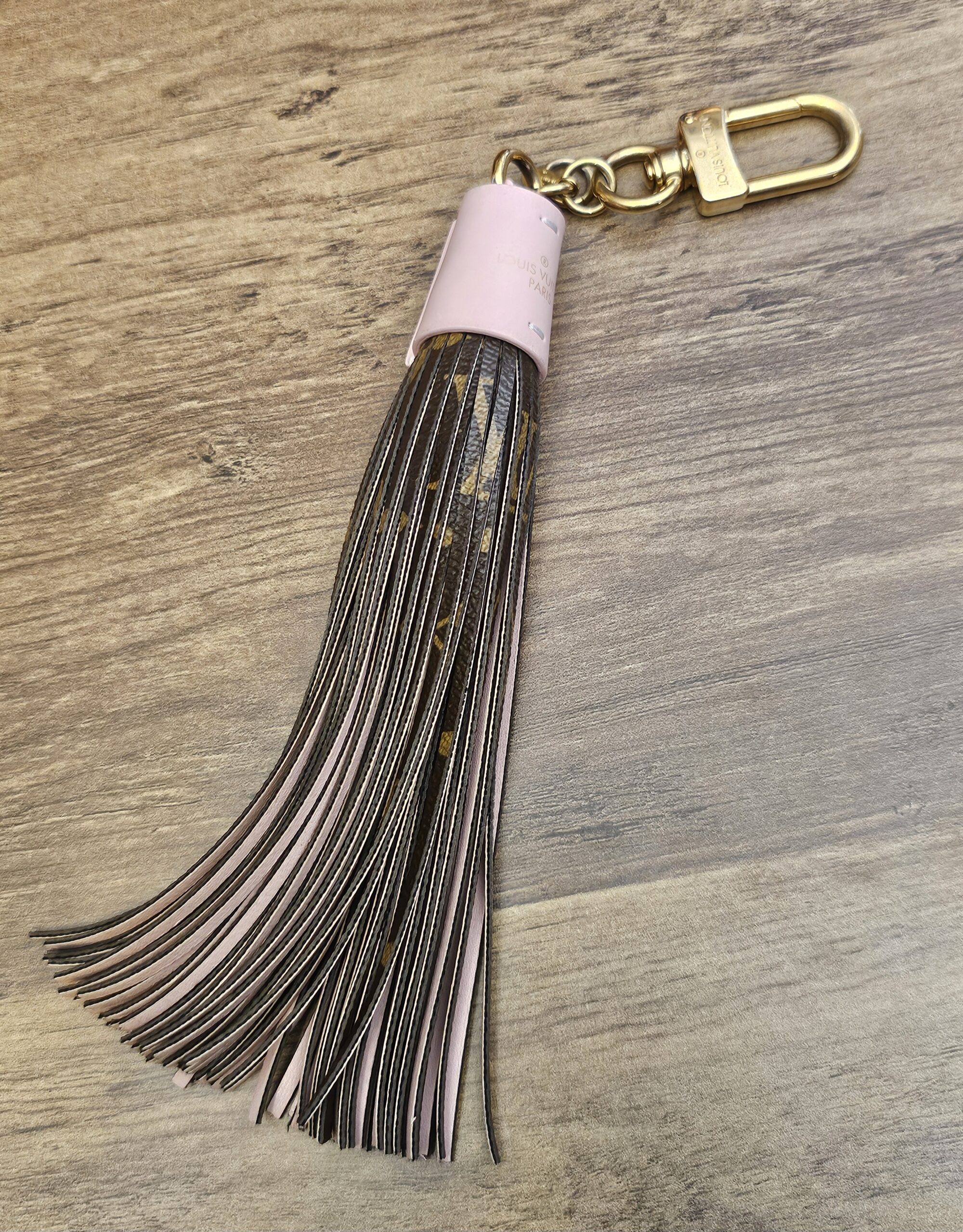 Louis Vuitton Monogram Tassel Bag Charm Pink - full length with the pink leather cap and gold-tone clasp