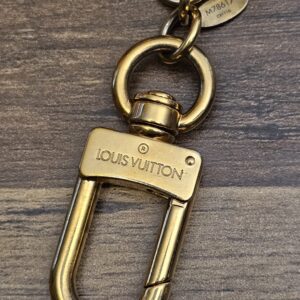 LOUIS VUITTON engraved gold-tone clasp