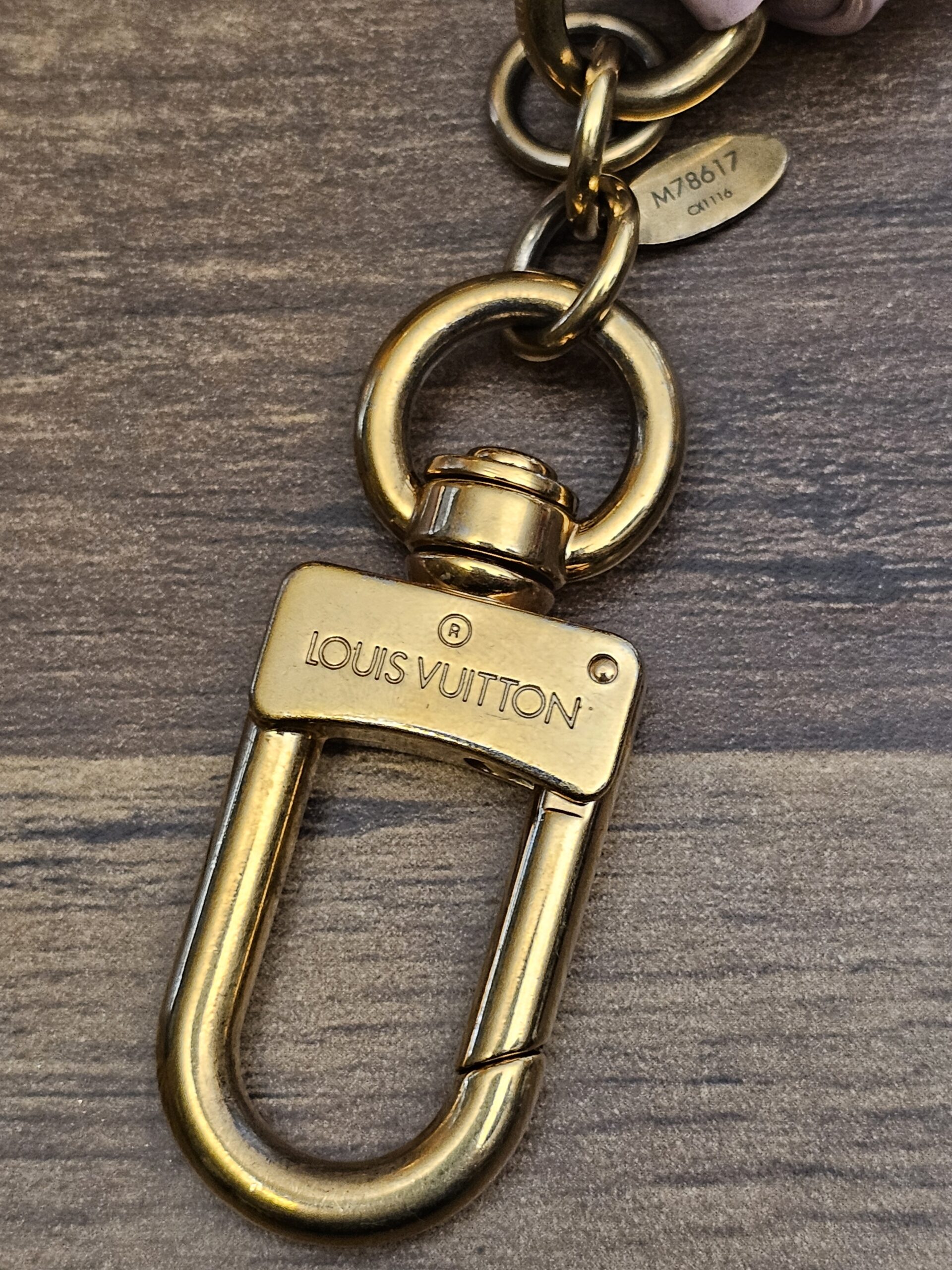 LOUIS VUITTON engraved gold-tone clasp