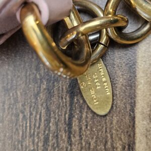 Chain and tag showing scratches and finish wear