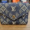 Louis Vuitton Since 1854 Victorine Wallet Blue Jacquard - front view with the envelope flap and gold-tone snap