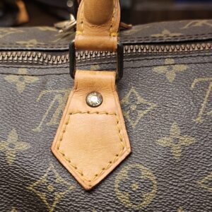 Handle tab and rivet on the front with honey patina