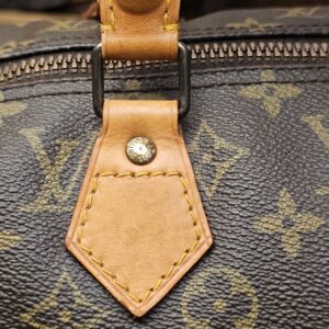 Handle tab with darkened vachetta