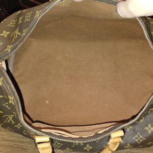 Open top showing the brown canvas lining