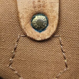 Interior snap tab with a worn stamped code