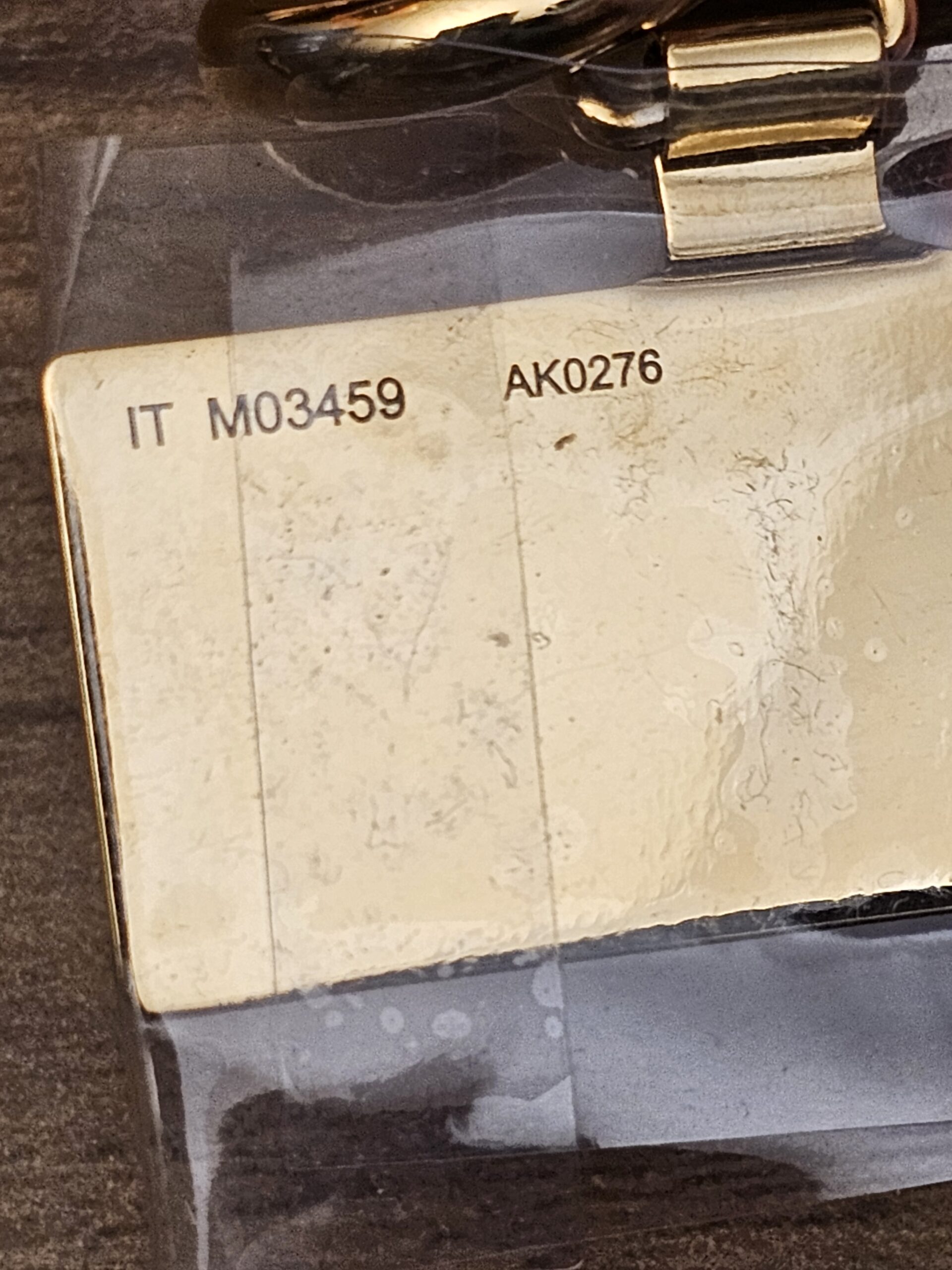 Back of the logo plate stamped M03459 AK0276