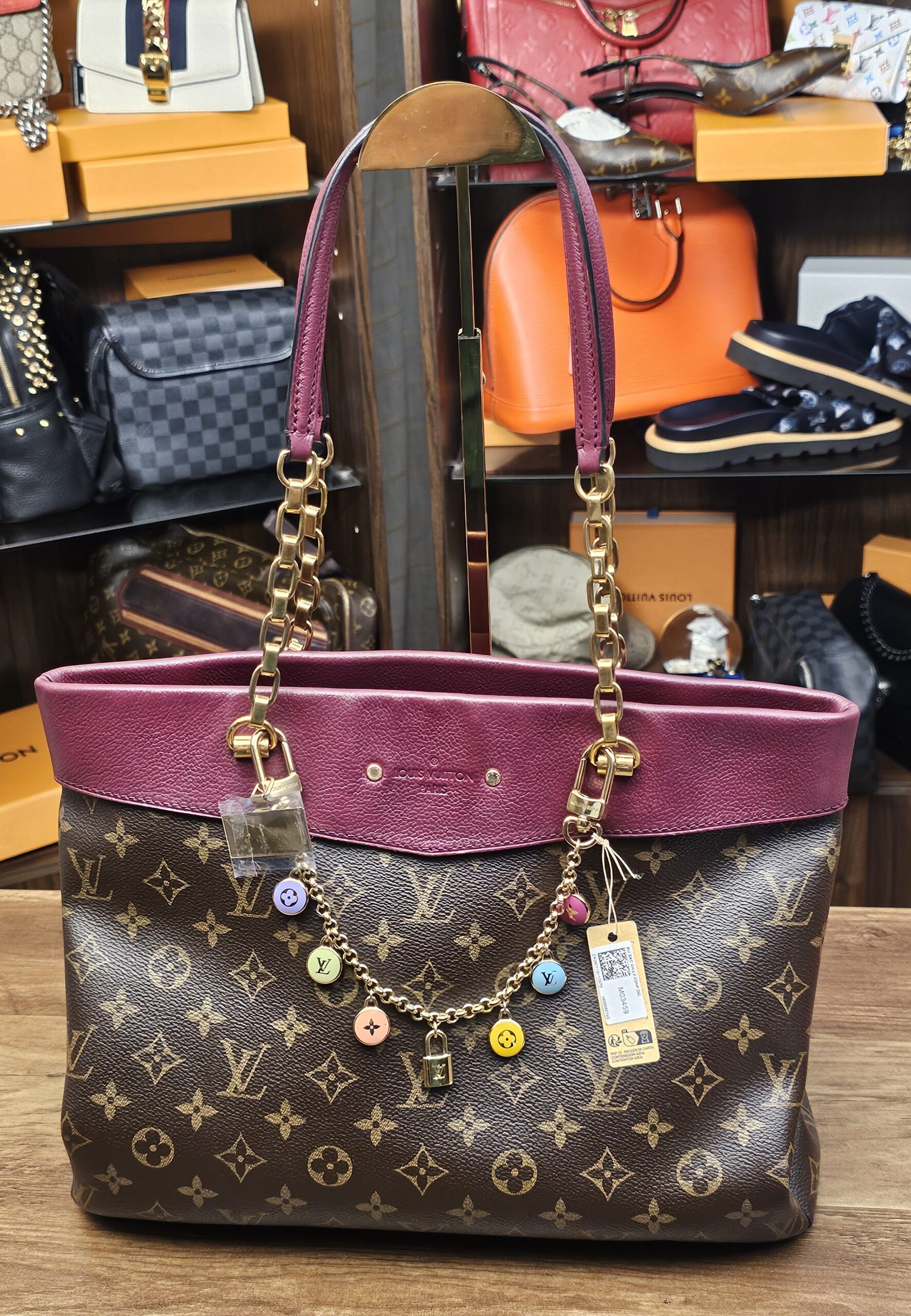 The chain charm on a Monogram canvas tote