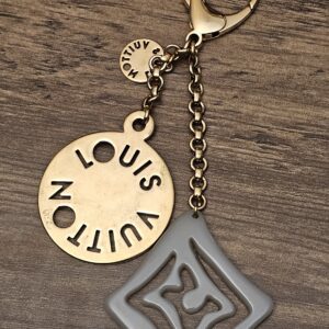 Full length of the charm on its chain and clasp