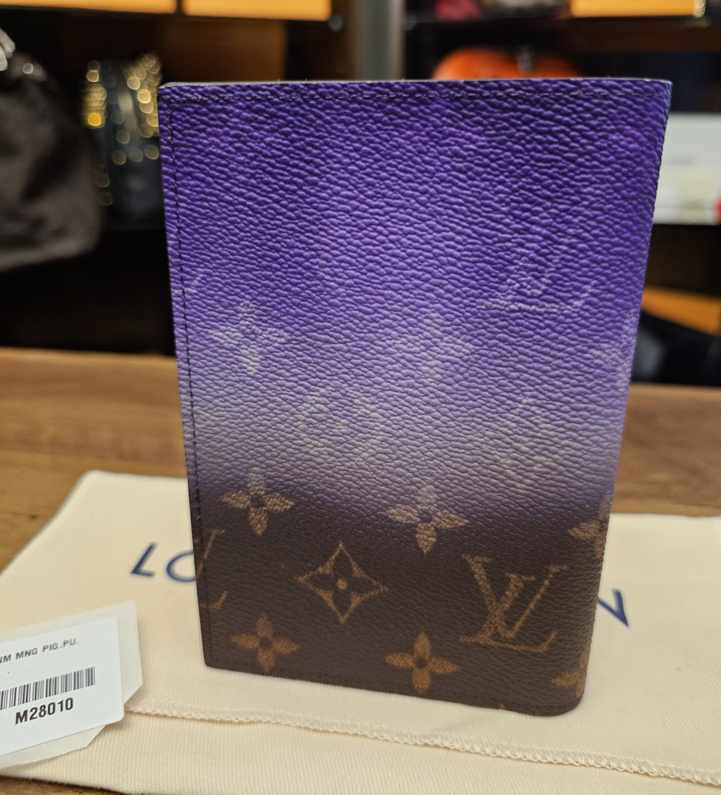 Back of the cover on its dust bag with the retail tag