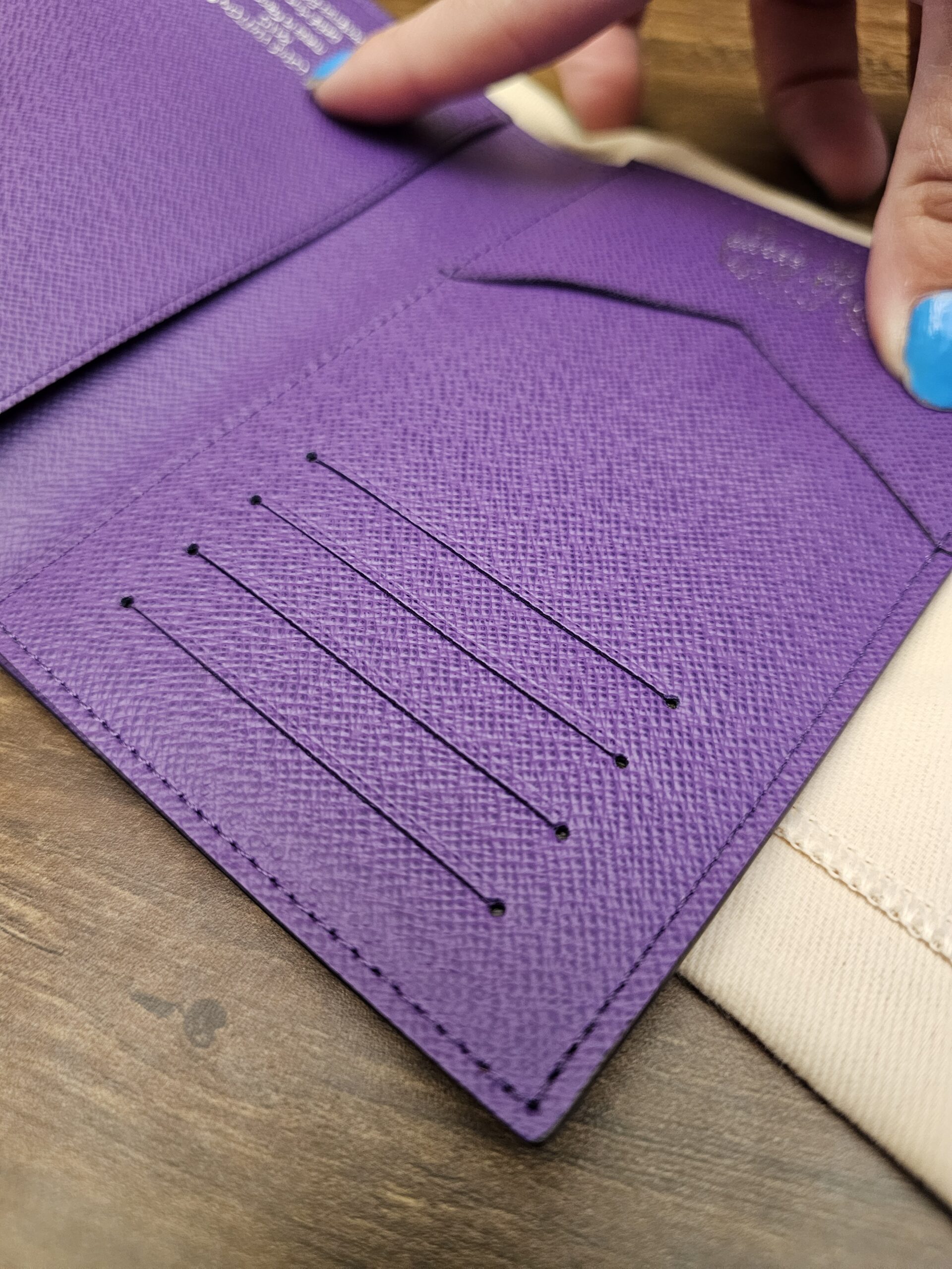 Card slots inside the purple leather interior