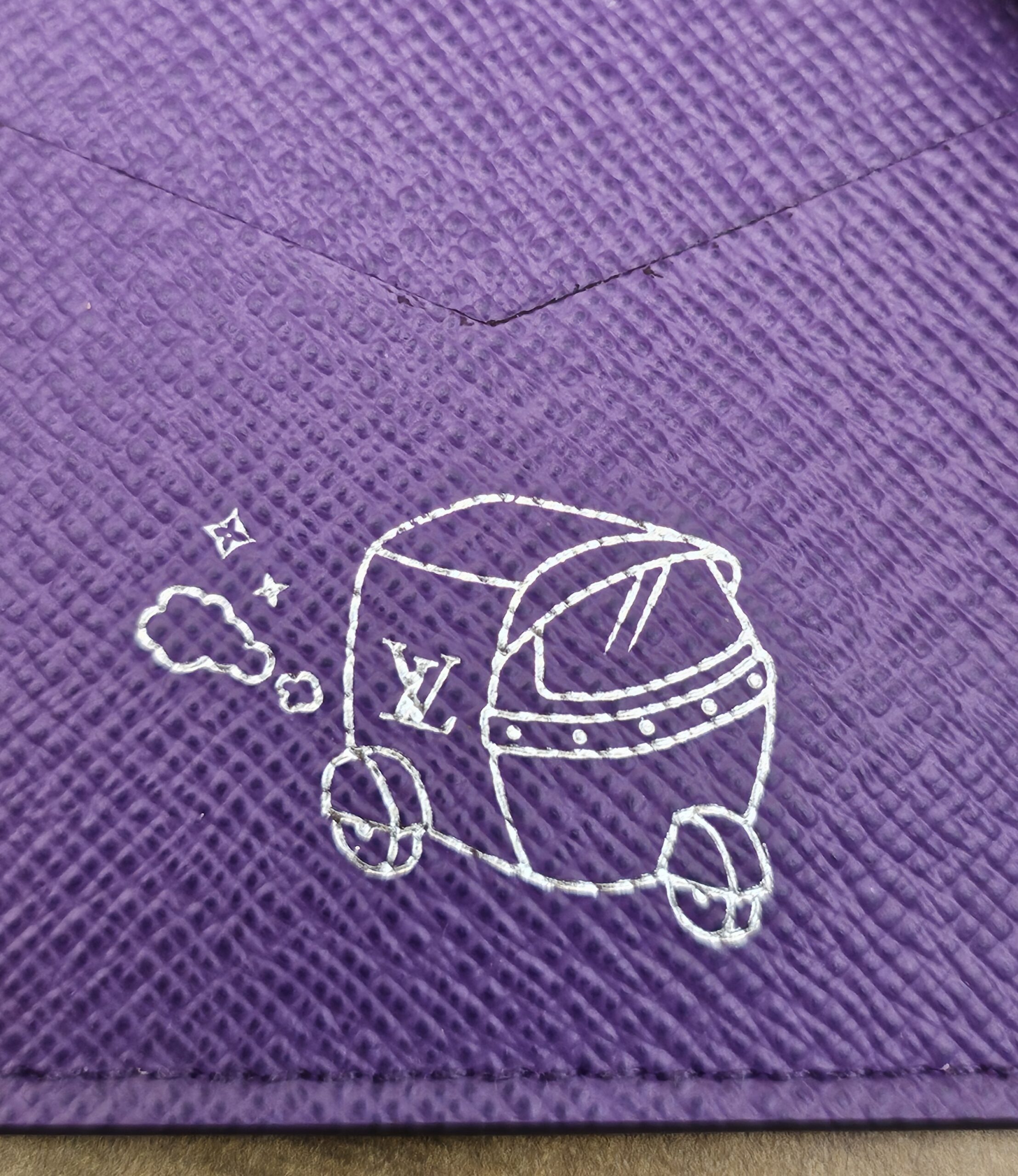 Close up of the silver travel illustration inside the cover