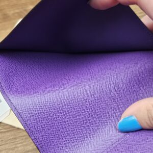 Passport pocket in the purple leather lining