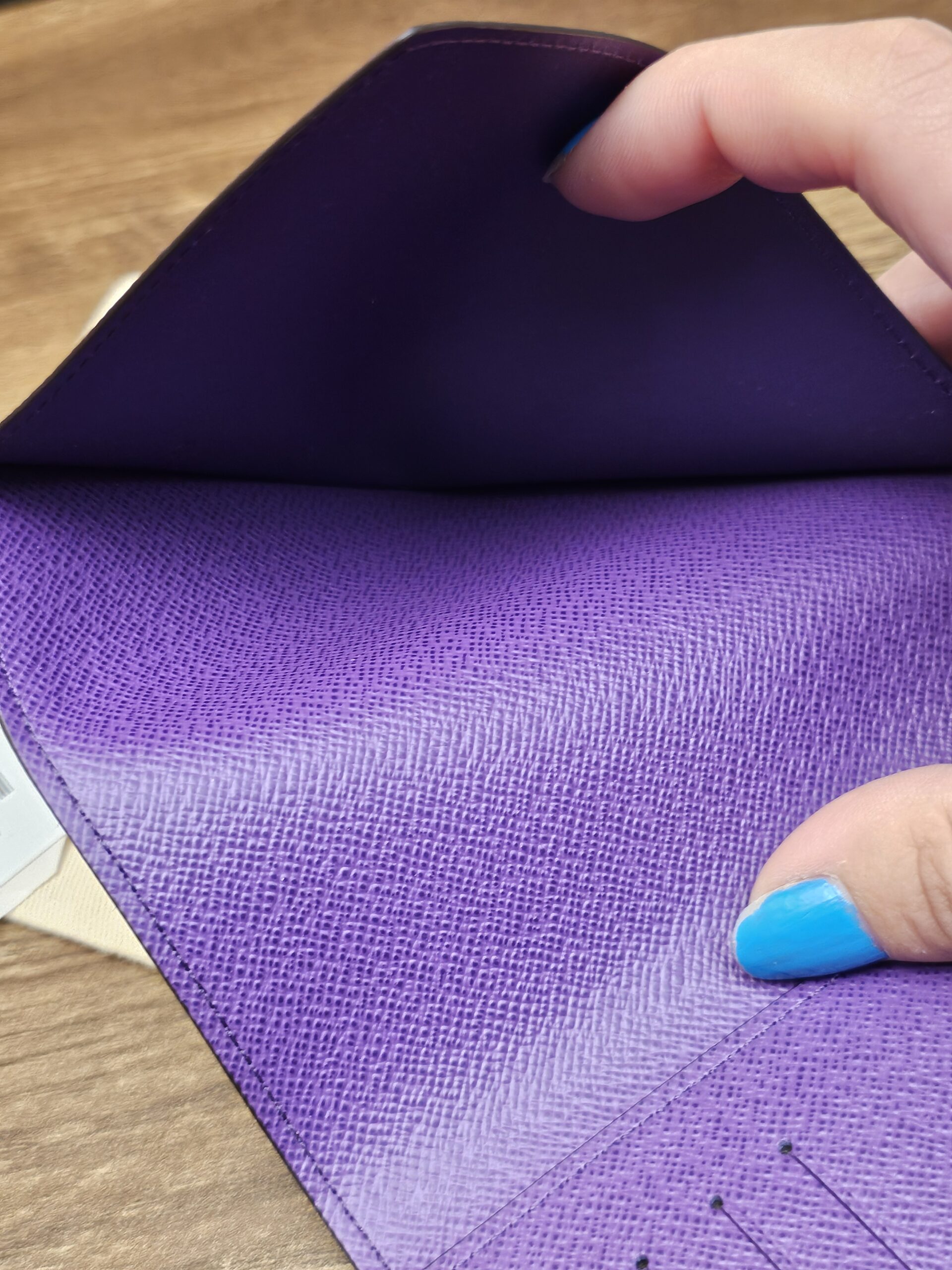 Passport pocket in the purple leather lining