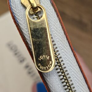 Engraved gold-tone zip pull