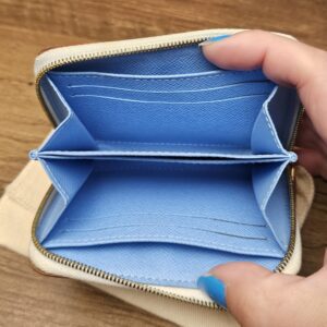 Open purse showing the blue interior and card slots