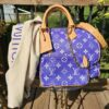 Louis Vuitton Speedy P9 Bandoulière 40 Amethyst Purple - front view with the matching pouch, strap and dust bag