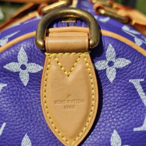 Close up of the leather side tab and brass D-ring