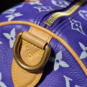 D-ring and side tab beside the top zip