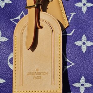Leather name tag stamped with the logo