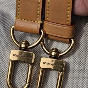 Engraved clasps on the shoulder strap