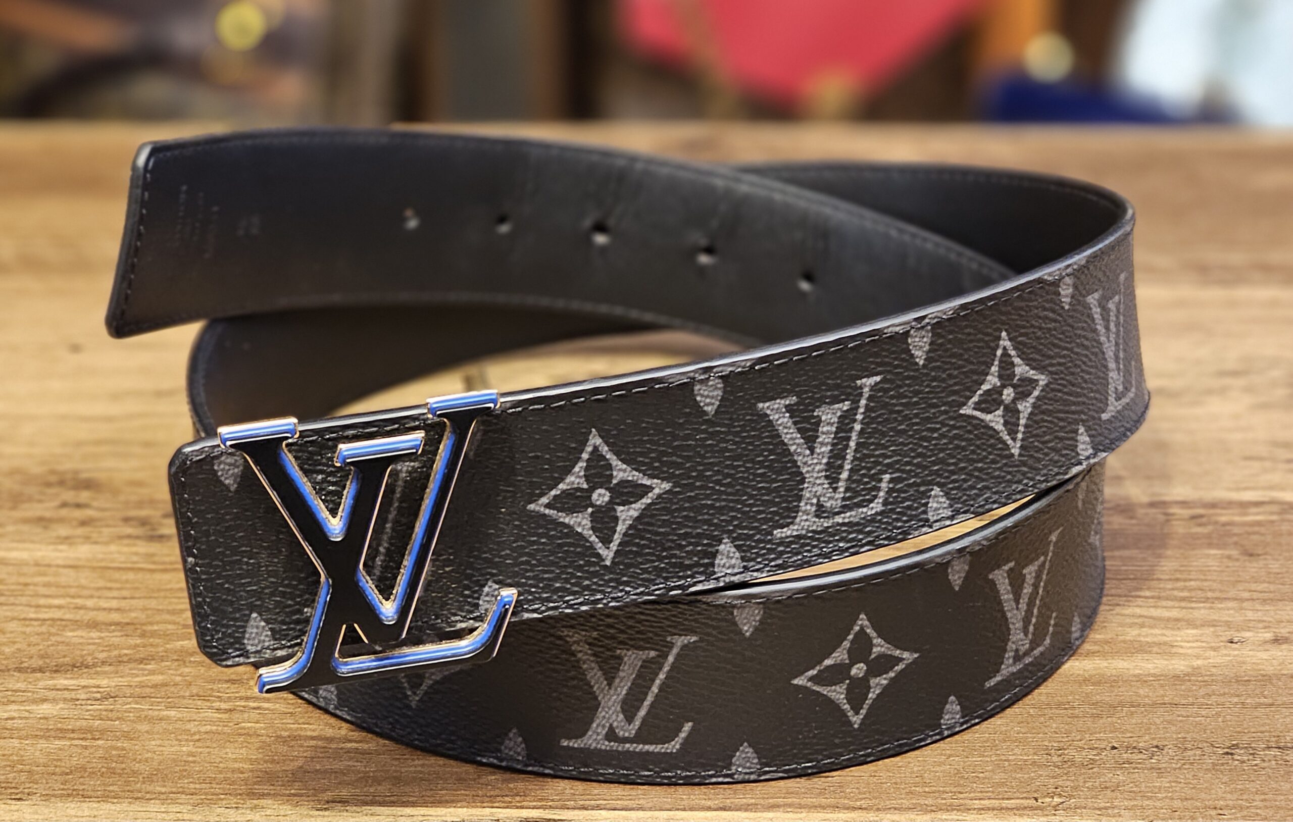 Louis Vuitton Monogram Eclipse LV 3 Steps 40mm Reversible Belt Size 95 - coiled with the black and blue LV buckle