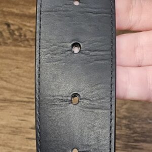 Leather side showing creasing around the holes