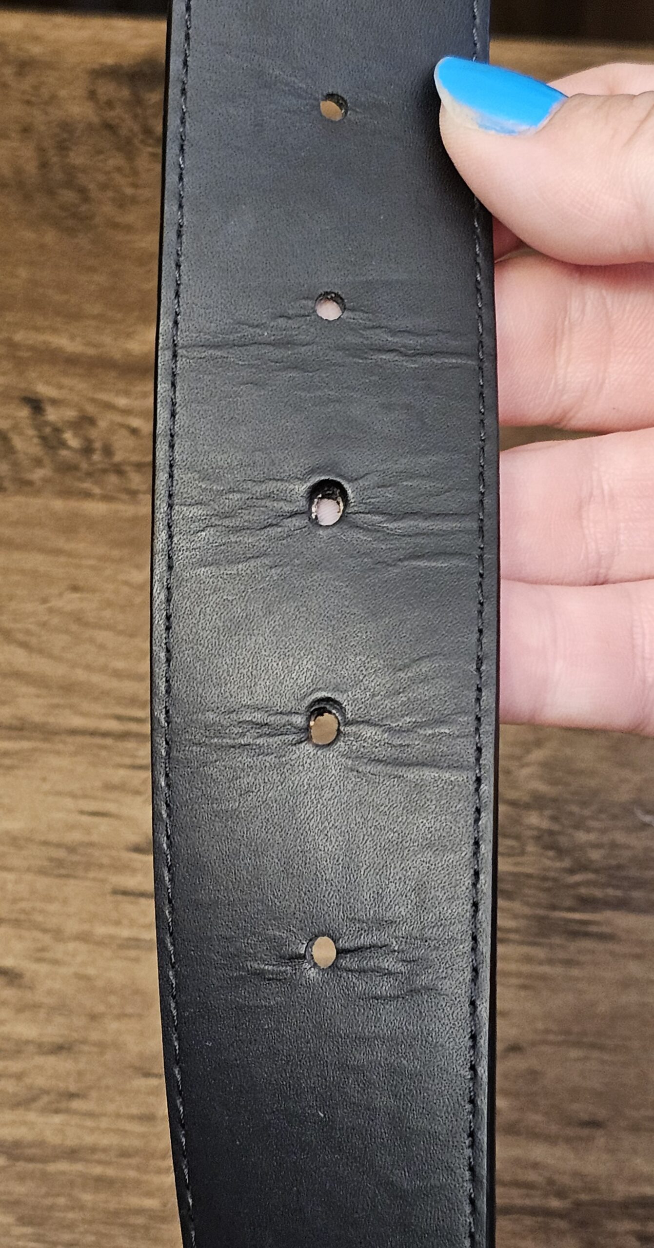 Leather side showing creasing around the holes
