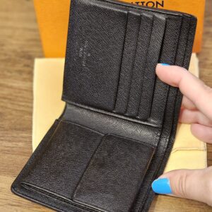 Open wallet showing the card slots and coin pocket
