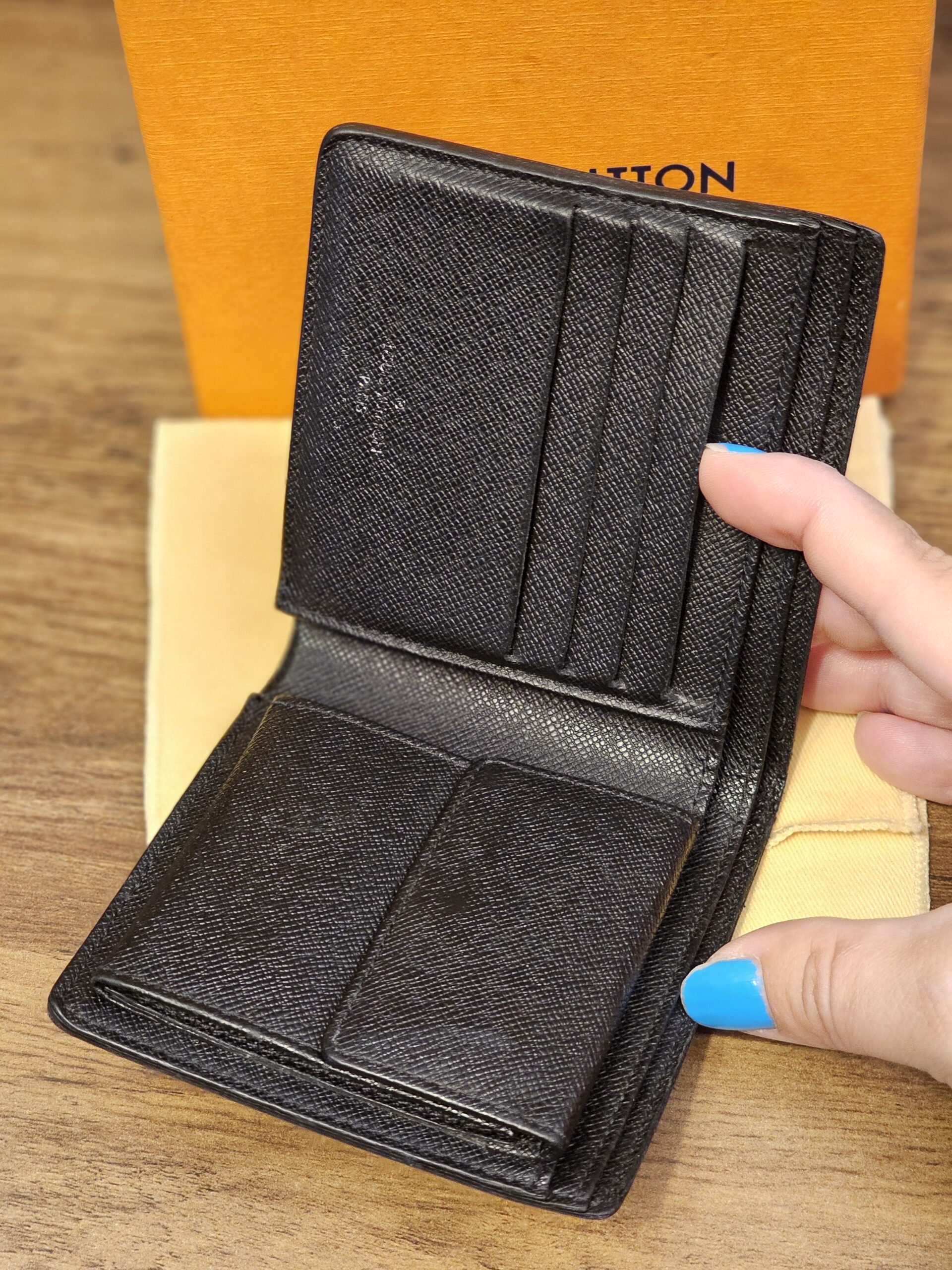 Open wallet showing the card slots and coin pocket