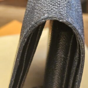 Fold spine showing wear and cracking