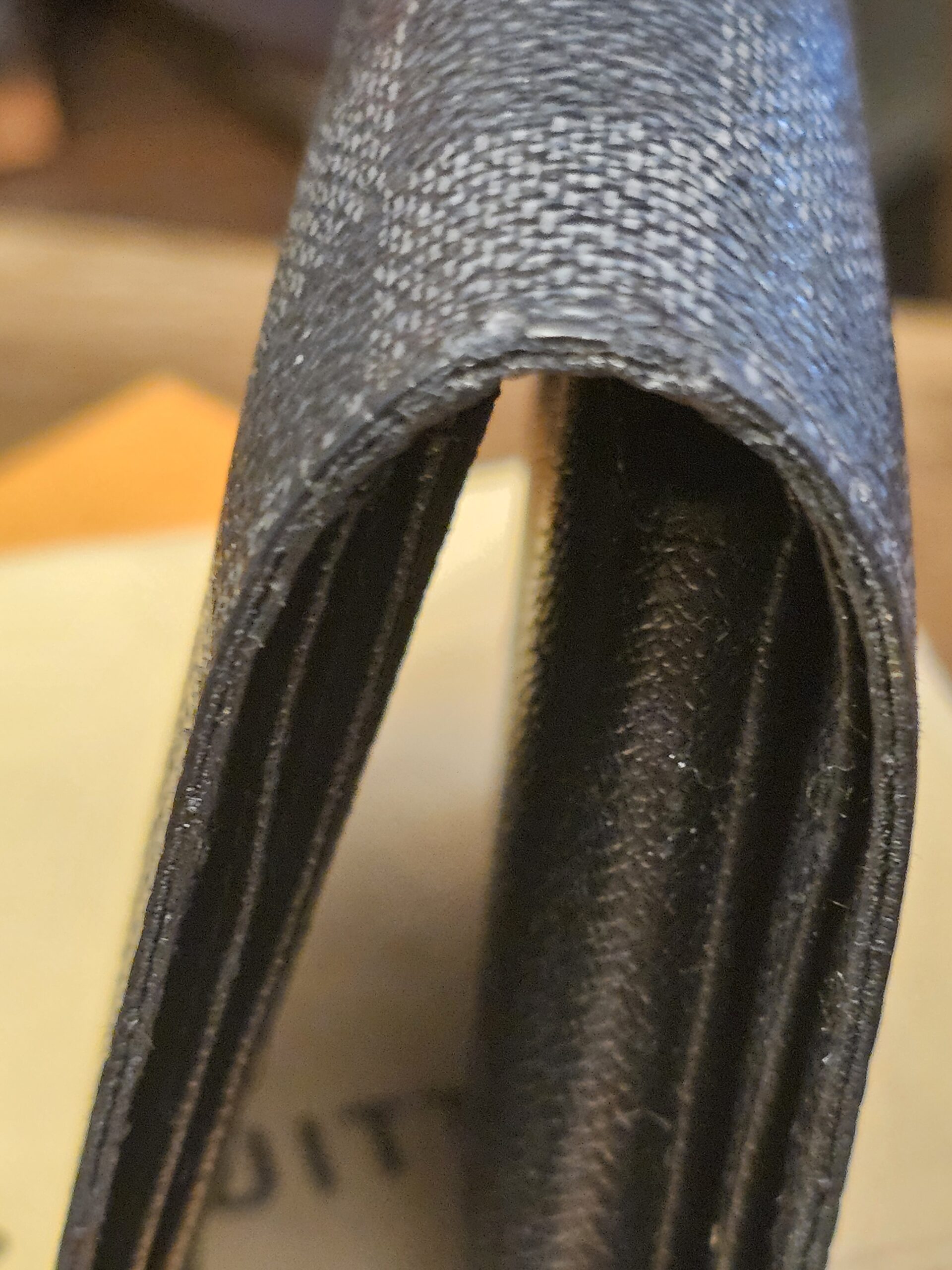 Fold spine showing wear and cracking