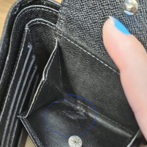Snap coin pocket with the old repair tape visible