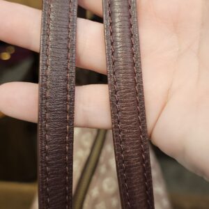 Dark brown leather shoulder straps held up