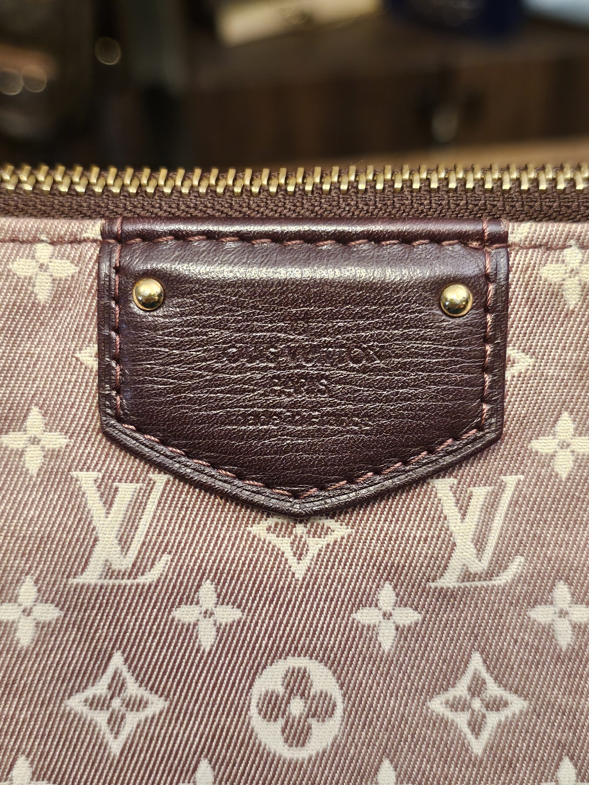 Leather patch on the front with the heat stamp
