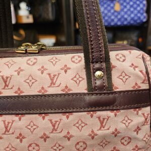 Burgundy trim band and strap tabs on the front