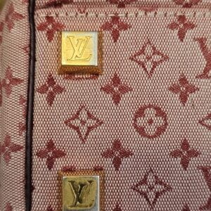 Gold-tone LV feet close up