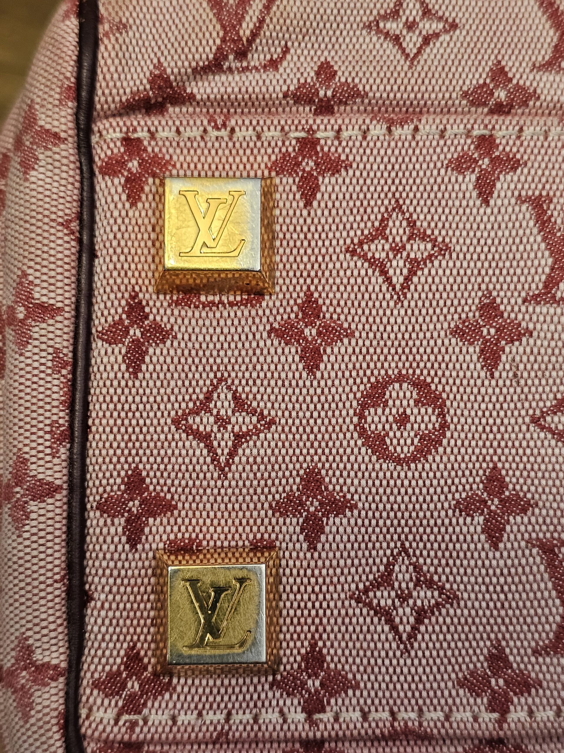 Gold-tone LV feet close up