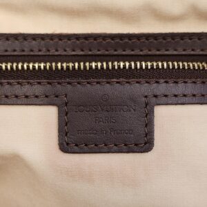 Made in France heat stamp patch above the zip pocket
