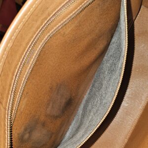Interior zip pocket showing the discoloration