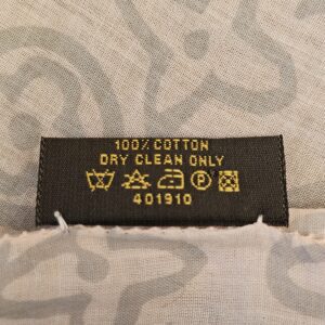 Care label reading 100% cotton, dry clean only, 401910