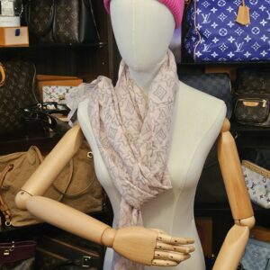 Wrapped loosely around the neck on a mannequin