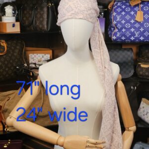 Tied over the head on a mannequin with its 71 by 24 inch size marked