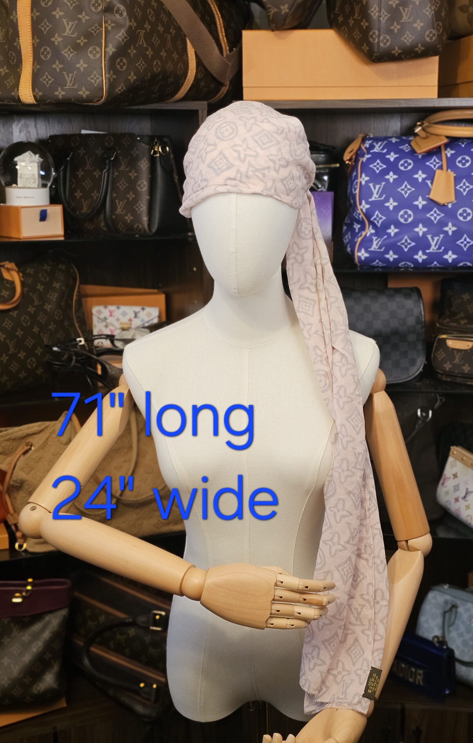 Tied over the head on a mannequin with its 71 by 24 inch size marked