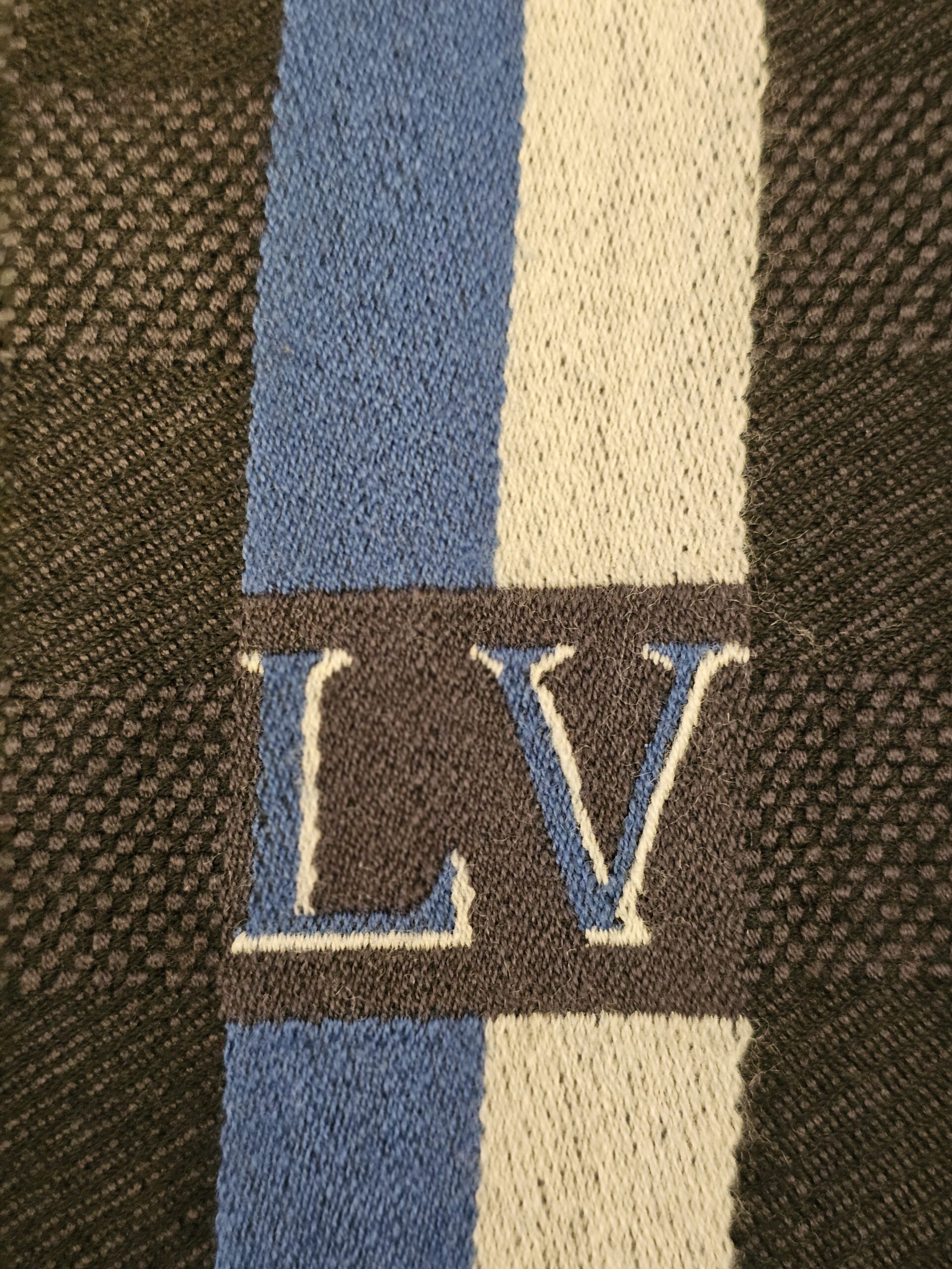 LV initials woven into the blue and cream stripe