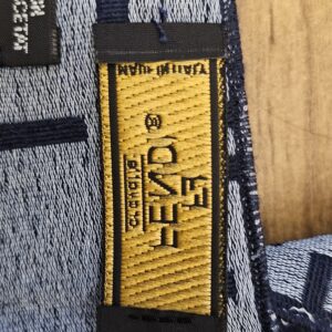 Woven label tab along the edge